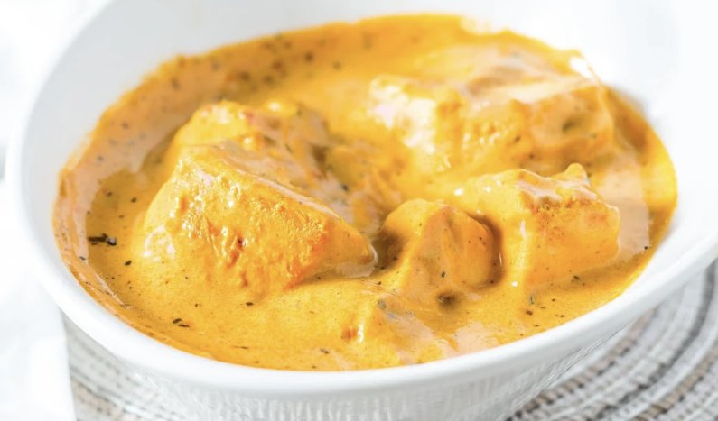 Creamy chicken curry in a rich orange sauce