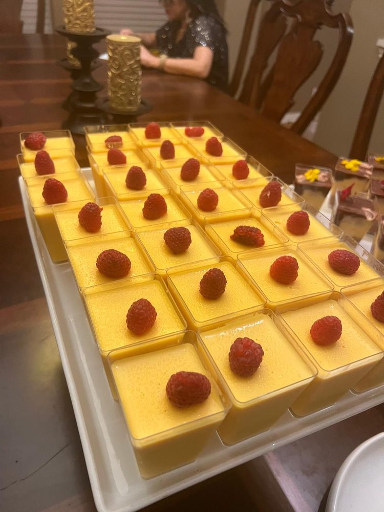 Mango dessert cups topped with fresh raspberries